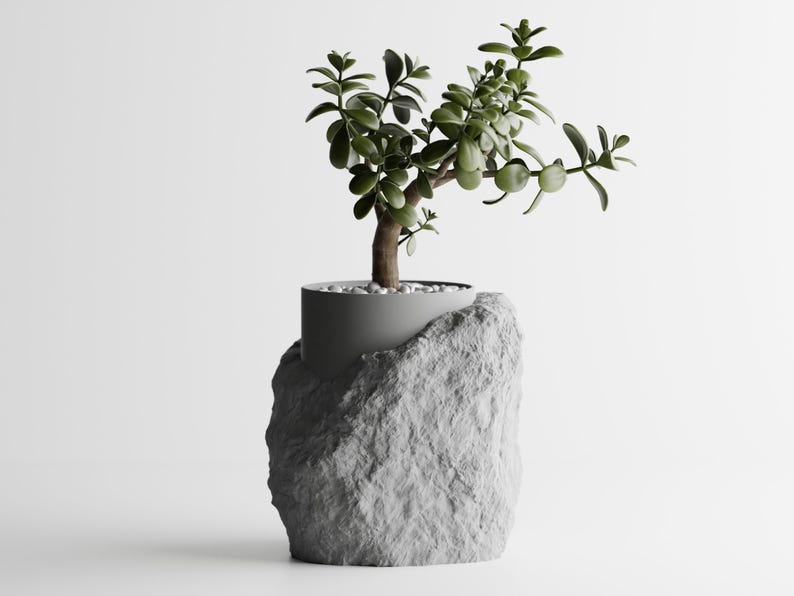 Eine halbverpackte 3D-gedruckte Vase mit Steinstruktur und moderner Ästhetik